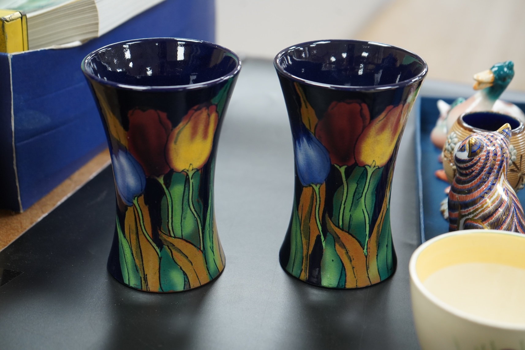 A collection of mixed porcelain and pottery to include four Worcester vases, one signed H. Blake, Clarice Cliff crocus pattern cup, saucer and sugar bowl and two Doulton Imari paperweights, largest 13cm high